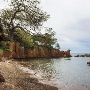 Picturesque beach and red rocks