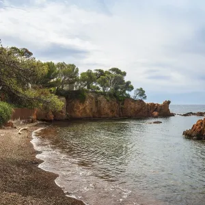 Picturesque beach and red rocks
