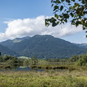Picturesque moorland landscape with mountains under a blue sky and white clouds Picturesque moorland landscape with mountains under a blue sky and white clouds