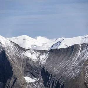 Picturesque mountain landscape with snow-capped summit