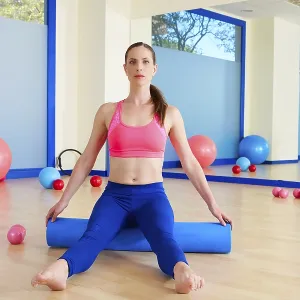 Pilates woman roller sit roll exercise workout at gym indoor Pilates woman roller sit roll exercise workout at gym indoor