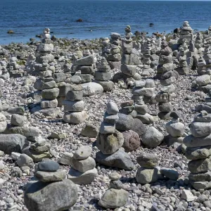 Piled stones on the shore of the island of Stora grundet on the northern tip of the Swedish island of Oland