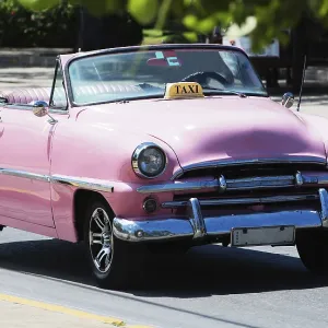 Pink American convertible classic car on street in Havana Cuba Pink American convertible classic car on street