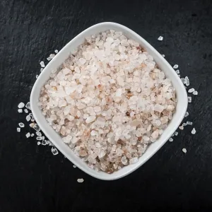 Portion of Himalayan Salt on a rustic slate slab (selective focus)