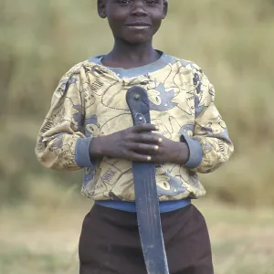 Portrait of a little boy with a big knife Portrait of a little boy with a big knife