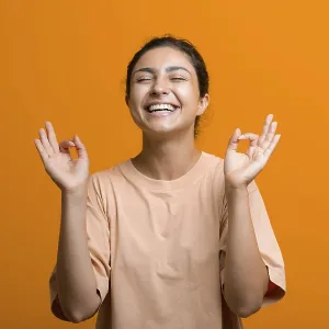 Portrait of young adult successful indian woman meditating zen like with ok sign mudra gesture Portrait of young adult successful indian woman meditating zen like with ok sign mudra gesture