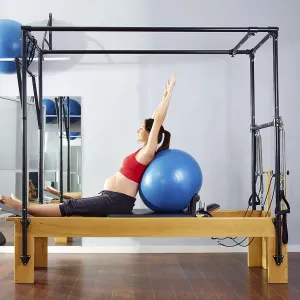 Pregnant woman pilates reformer fitball exercise workout at gym Pregnant woman pilates reformer fitball exercise workout at gym