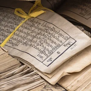 Printed sheets of Tibetan Abugida script prayer verses at Kumbum Monastery