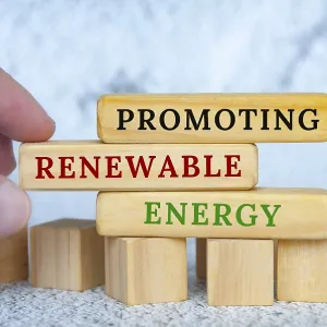 Promoting Renewable Energy text on wooden blocks