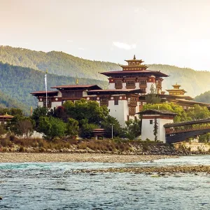 Punakha Dzong at sunset, with sunrays Punakha Dzong at sunset, with sunrays