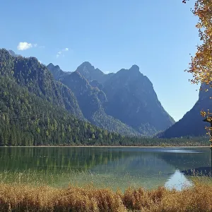Quiet mountain lake against light