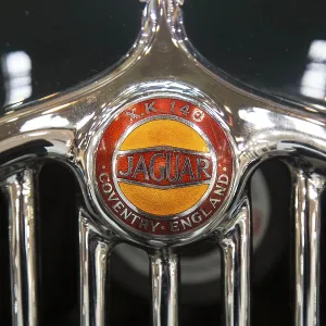 Radiator grille with logo of the Jaguar XK 140 Radiator grille with logo of the Jaguar XK 140