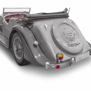 Rear view of a classic car isolated in white back with shadow Rear view of a classic car isolated in white back with shadow