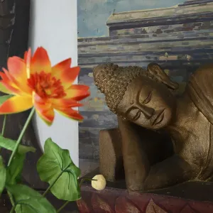 Reclining Buddha statue on an altar in a prayer room of the Brahma Vihara Buddhist monastery Reclining Buddha statue on an altar in a prayer room of the Brahma Vihara Buddhist monastery
