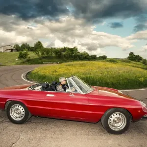 Red Alfa Spider 2000, convertible on winding road