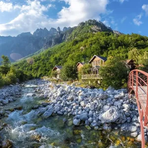 Red bridge along the river of Valbona Valley Red bridge along the river of Valbona Valley