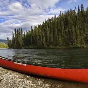 Red canoe on the shore of Big Salmon River