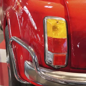 Detail of a red classic car with distinctive tail lights
