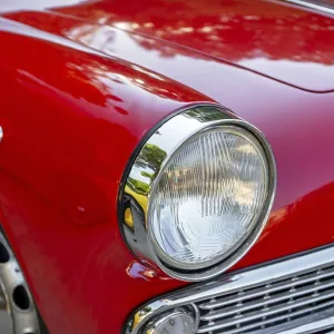 Red classic car in the park