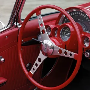 Red cockpit with a red steering wheel