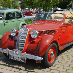 Red convertible with historic elegance