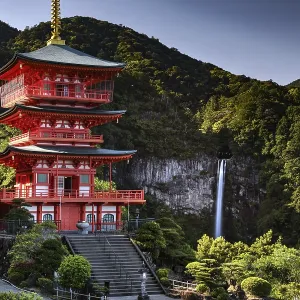 Red pagoda in front of Nachi Waterfall in the green forest of Seiganto-ji Red pagoda in front of Nachi Waterfall in the green forest of Seiganto-ji