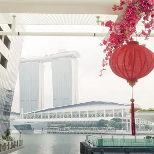 Red paper lantern with modern Singapore architecture surrounding