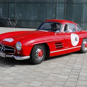 Red vintage Mercedes car with double doors Red vintage Mercedes car with double doors