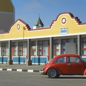 Red Volkswagen in front of a building in Swakopmund