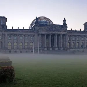 Reichstag Building at dawn with ground fog and backlighting Reichstag Building at dawn with ground fog and backlighting