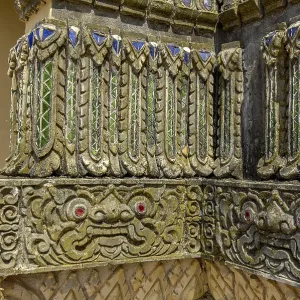 Relief work bas-relief by stonemason on outer wall of Buddhist monastery