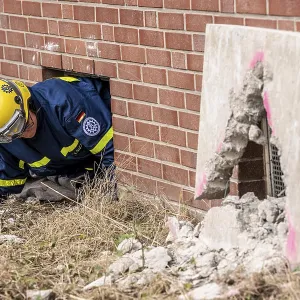 Rescue and recovery of people after a drone attack on residential buildings in a civil defence scenario