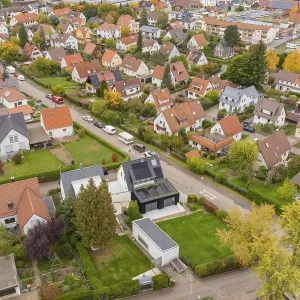 Residential area on the outskirts of town with modern and classic houses in an autumn atmosphere Residential area on the outskirts of town with modern and classic houses in an autumn atmosphere