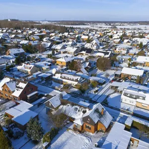 Residential district in winter under clear sky Residential district in winter under clear sky