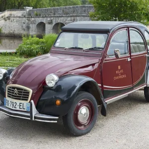 Retro Citroen 2CV vintage car in red and black Retro Citroen 2CV vintage car in red and black