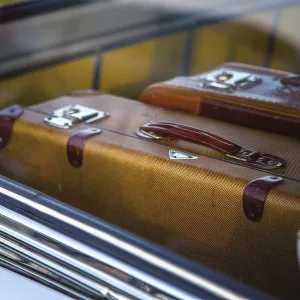 Two retro suitcase in retro car