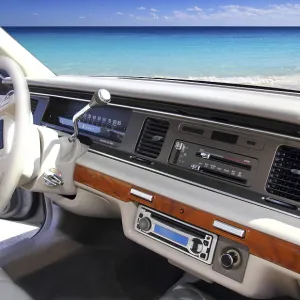 Retro vintage car indoor with tropical Caribbean beach in window