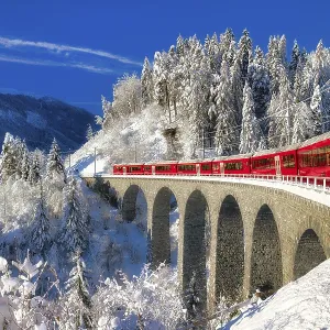 Rhaetian railway on viaduct in winter landscape Rhaetian railway on viaduct in winter landscape