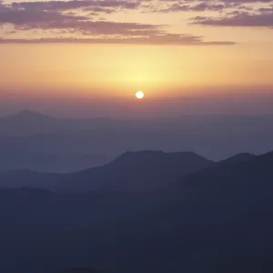 Rising sun under Carpathian mountains, Ukraine