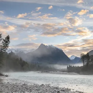 River Soca with Svinjak Mountain in the morning