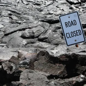 Road closed, a sign on a lava field in the eastern rift zone