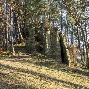 Rock formation in a forest illuminated by sunlight Rock formation in a forest illuminated by sunlight