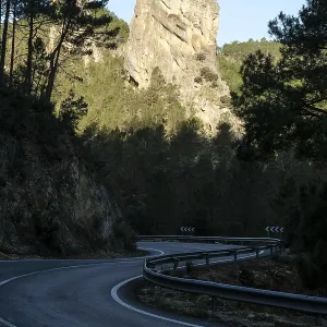 Rock in morning light, country road in the shade Rock in morning light, country road in the shade