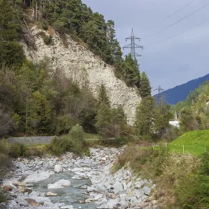 Rocks and high-voltage masts on the Ruetz river in the Stubai Valley between Telfes and Mieders