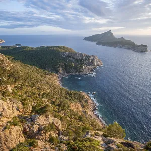 Rocky coast with an island, Sunset over the ocean