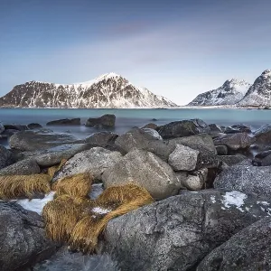 Rocky coast, mountains in the background Rocky coast, mountains in the background