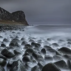 Rocky coast with surf, Unstad Beach Rocky coast with surf, Unstad Beach
