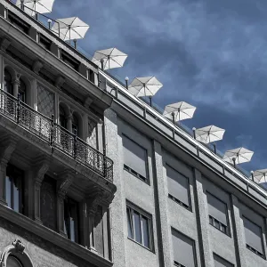 Roof Terrace With Sun Parasols On Historic And Modern Buildings In The Inner City Of Vienna In Austria
