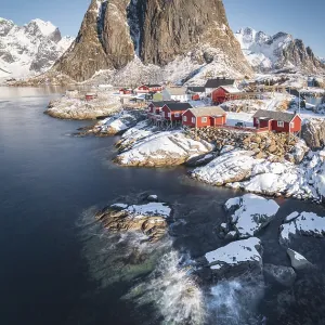 Rorbuer fishermen's cabins on the snowy fjord