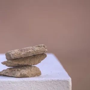 Three rough stones placed on top of each other Three rough stones placed on top of each other